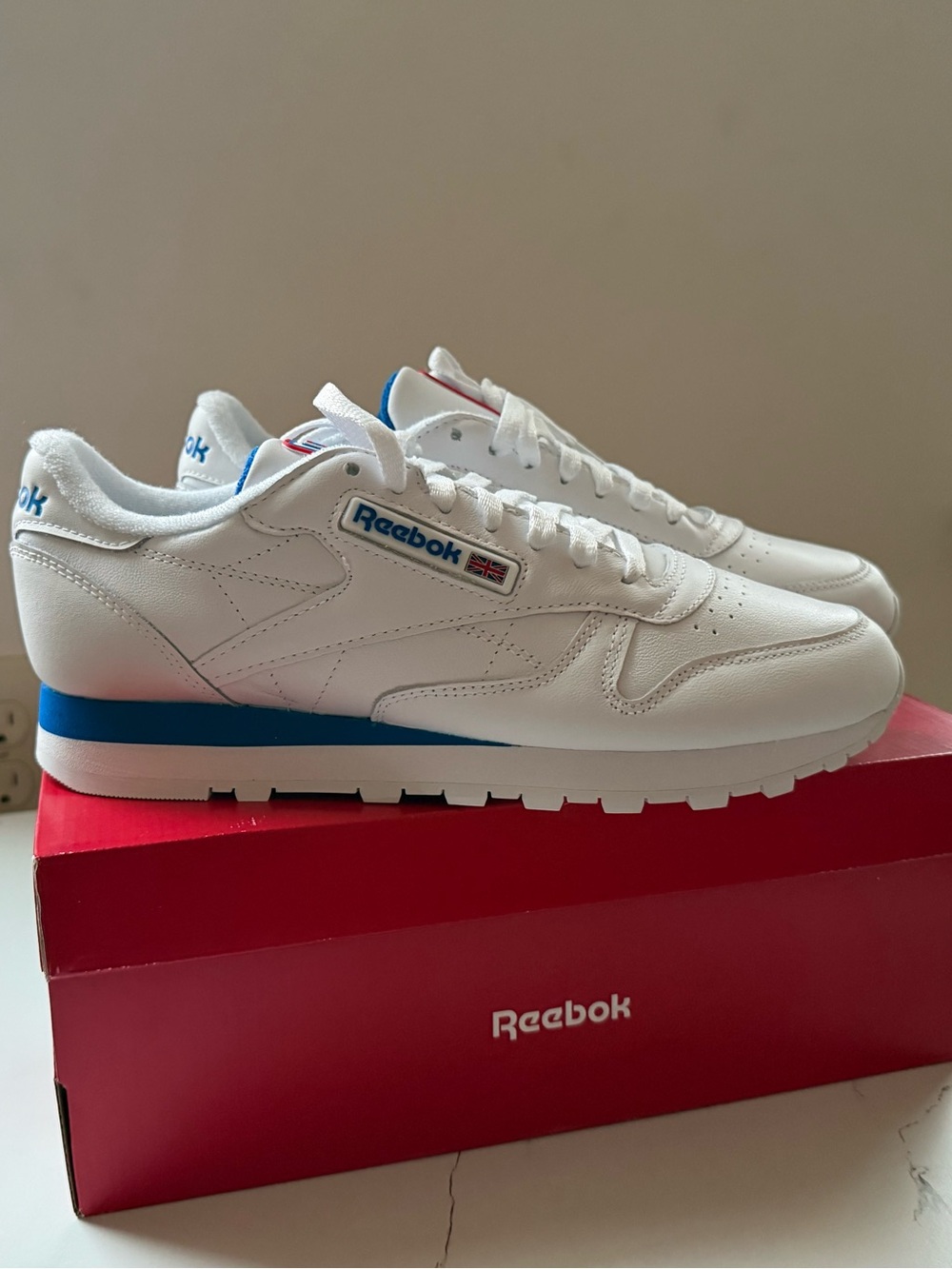 Reebok Men’s Classic White Sneakers with Blue Accents